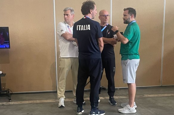 Italian boxing staff talk to members of the IOC in the aftermath of Carini’s loss.