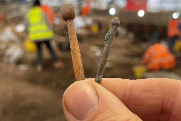 Two Roman hairpins from the dig in Leicester. On the left, a pin with a spherical head carved from animal bone, and on the right a copper alloy pin with a grooved head (probably broken).