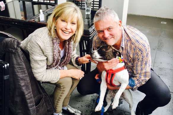 Newton-John with Neil McMahon (and dog Miss Maudie) in 2017.