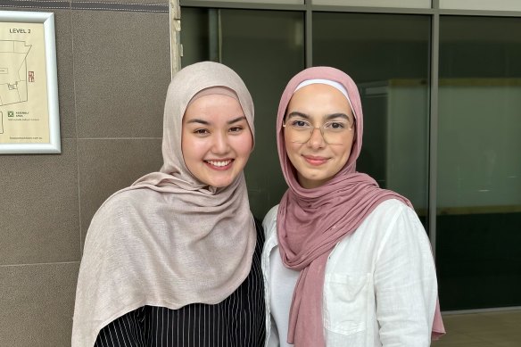 Zahra Fouladi (left) and Nuha Khaleal (right) celebrate their ATARs at Alpha Omega Senior College in Auburn this morning.