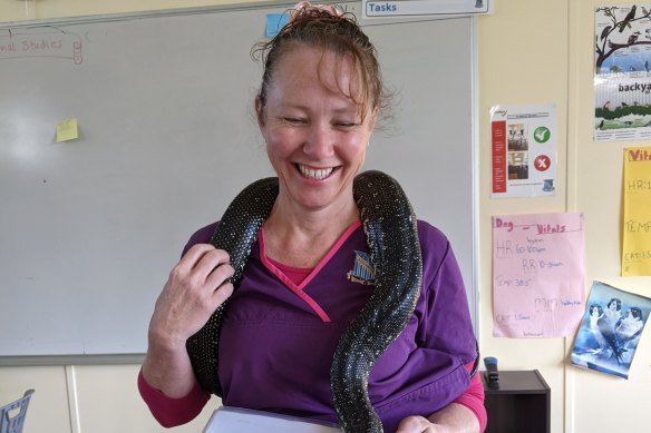 Teacher Nicki Doyle with the classroom’s diamond python Lucy.