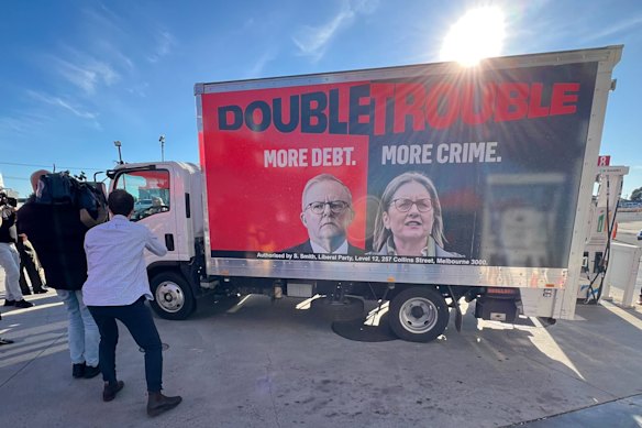 Peter Dutton made a campaign stop to fuel up a truck with a banner describing Prime Minister Anthony Albanese and Premier Jacinta Allan as “double trouble”.