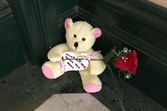 A teddy bear and rose left on the steps of Clarence House after Michaela Dunn was killed there on Tuesday. 