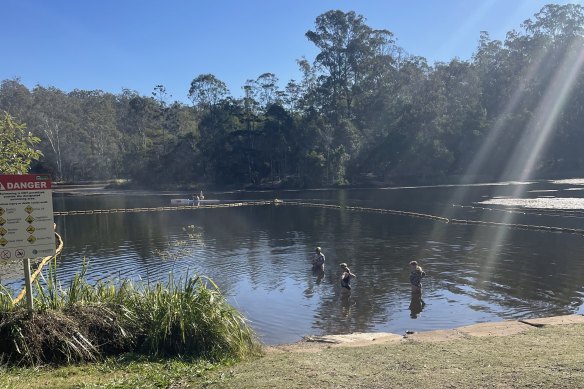 Enoggera Reservoir is a much-loved swimming spot in west Brisbane, despite the murky water.