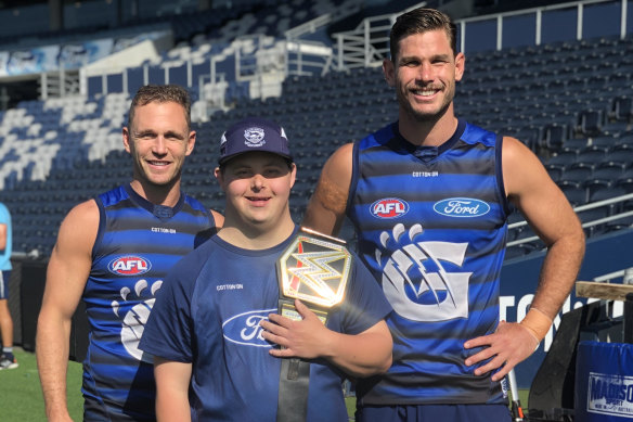 Geelong footballers Joel Selwood (left) and Tom Hawkins with Sam Moorfoot