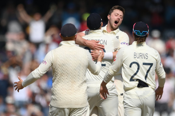 Ollie Robinson celebrates after taking the wicket of Virat Kohli.