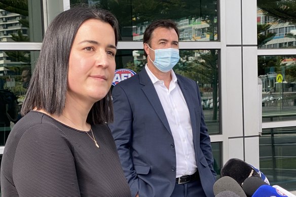 Laura Kane, pictured here with now Essendon coach Brad Scott, has been at the AFL since 2021 after building an impressive reputation at North Melbourne.