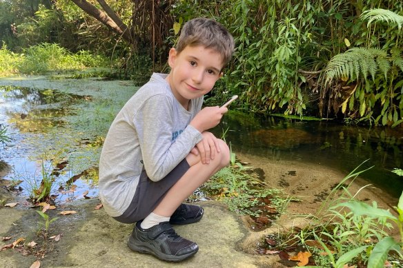 Seven-year-old Henry Lewis is an expert “frogger”, clocking more than 1600 FrogID recordings with his dad Chris.