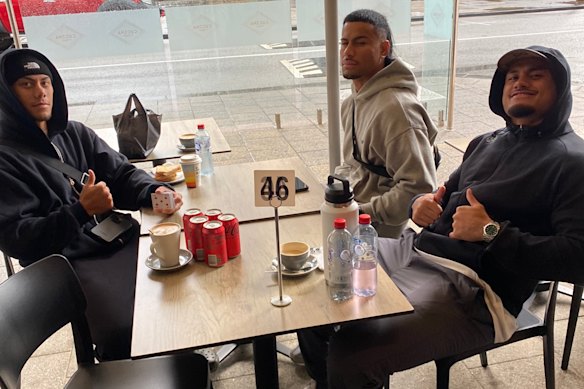 Jarome Luai, Stephen Crichton and Spencer Leniu wait for pal Brian To’o at a Perth cafe with five cans of Coke Zero and a caramel latte.