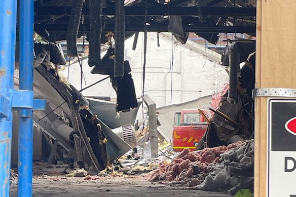 The view of the collapsed roof from the front of the building.