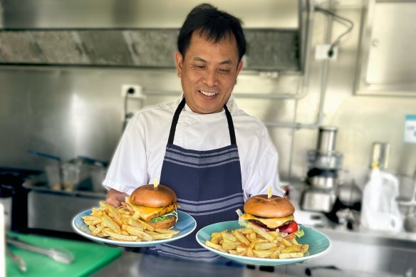 Head chef Paulie Nguyen with his bestselling cheeseburgers.