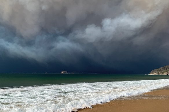 The view of the fire-generated storm over the Malua-Batemans Bay area as seen from about 20 kilometres away. "It was god awful," Mr Constance said of his experience.