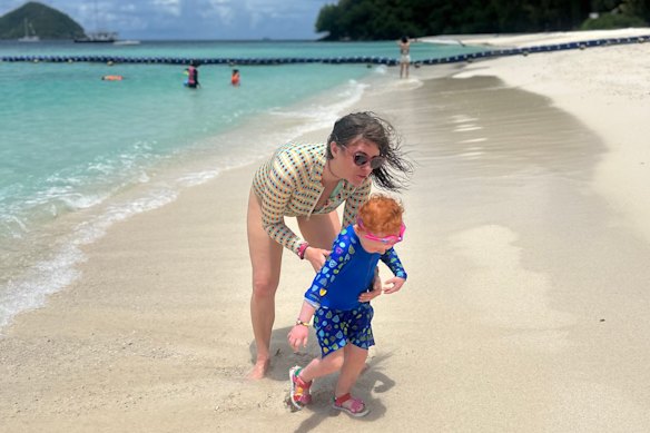 The author with daughter on the beach in Phuket.