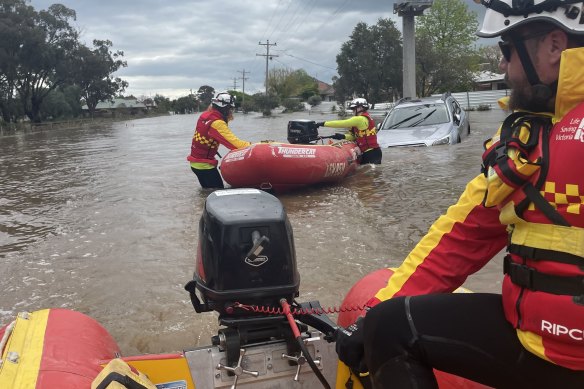 Life Saving Victoria volunteer Ben Rooks rescues people trapped in floodwaters.