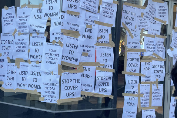 A Country Road store in Melbourne is plastered in posters after the retailer launched an internal investigation into alleged mishandling of staff complaints about bullying and harassment.