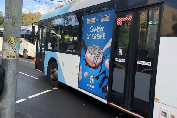 A junk food ad on the side of a bus.
