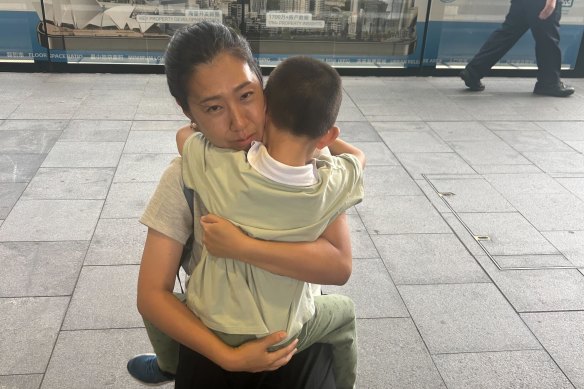 Paige Young with her son at Chatswood Station.