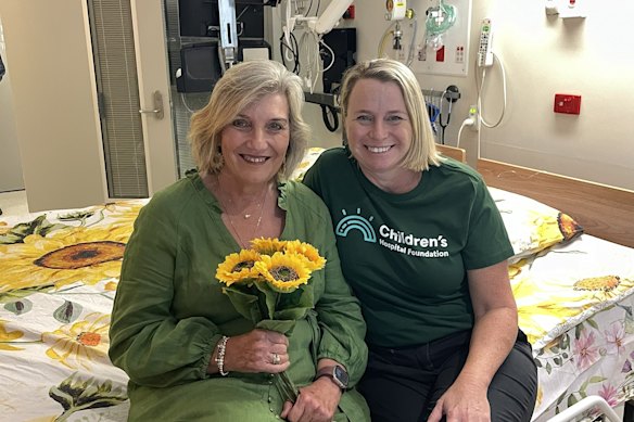 Jenny Jenner and Kerry Williams with Queensland Children's Hospital's new lap bed. 