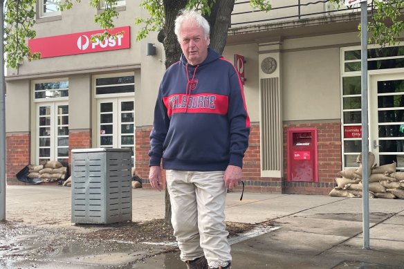 Terry Masterson, owner of Mooroopna Post Office, inspects his business.