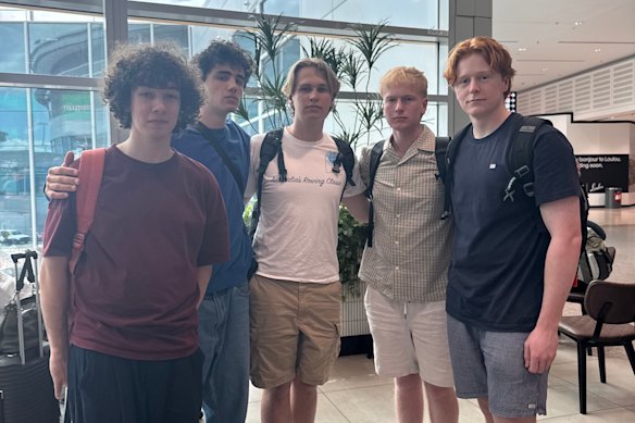 Oli Gill, Alex Marchesani, Henry Willee, Tom Feeney and Oscar Sorell wait at Sydney Airport on Saturday for a flight to Brisbane. 