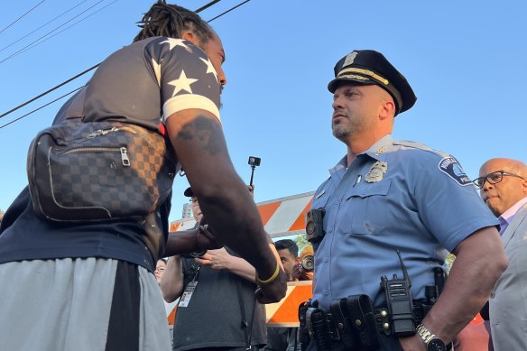 Recently appointed Minneapolis police chief Brian O’Hara deals with an angry protester at the third anniversary of George Floyd’s death.