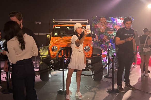 A guest at Turo’s Sydney launch last week takes a selfie in front of a luxury vehicle.