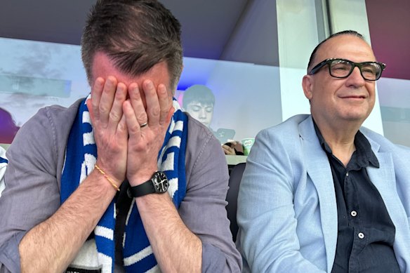 Bulldogs fan and NSW Premier Chris Minns, next to ARLC chair Peter V’Landys.