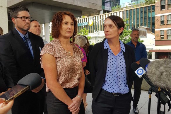 Catherine Nielsen and Susie Forte, wife of slain officer Brett Forte, outside court. 