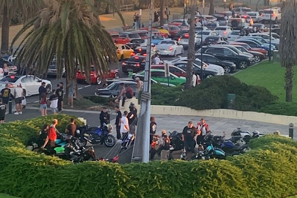 Waterfront Place, in Port Melbourne, full with cars and motorcycles on a summer’s evening.