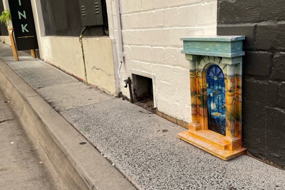 A tiny door in the city made by Brisbane artist Mace Robertson.