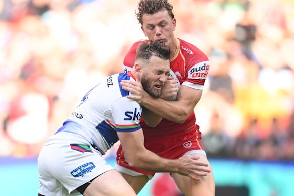 Kurt Capewell makes a tackle for the New Zealand Warriors on Dolphins winger Jack Bostock. 