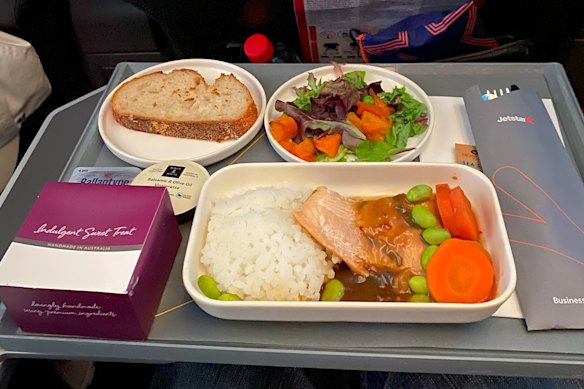 The shiitake-glazed salmon fillet with rice is quite good. It’s served early in the flight.