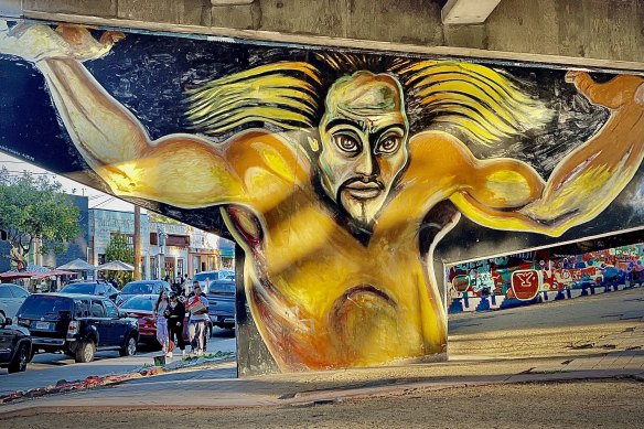 A highlight of the tour is the murals painted upon the freeway pylons which march through its greenery.