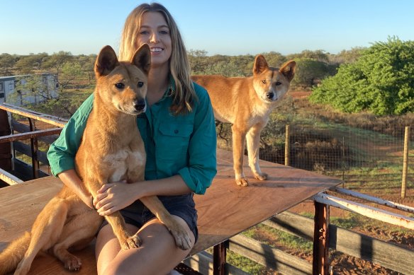 Zali Jestrimski at Wooleen Station with dingoes Eulalia and Steven.