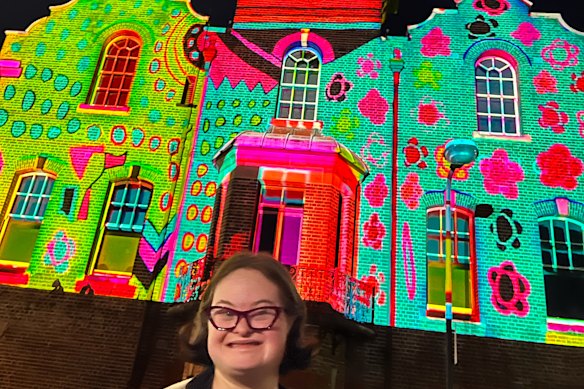 Bridget Kelly in front the ASN Clock Tower in the Rocks, on which her artwork was projected during Vivid.