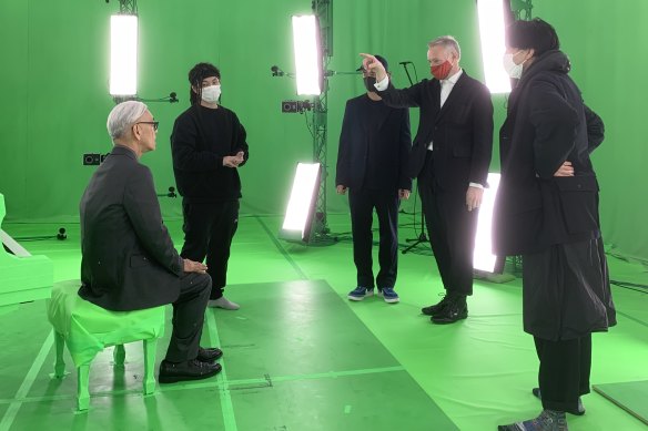 Filming KAGAMI with the green screens as backdrop.