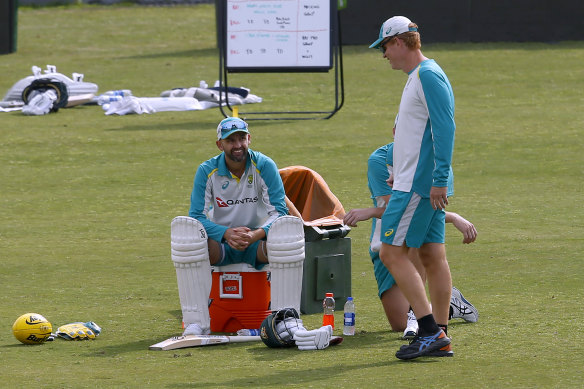 McDonald (right) talks to Nathan Lyon during a training session in Pakistan.