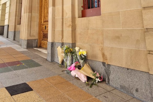 Flowers at the sight of the fatal bus crash on Edward Street.