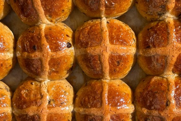 Hot cross buns at Fiore Bread in McMahons Point include Earl Grey-soaked currants, orange pulp, apricot cardamom jam glaze and an almond frangipane cross.