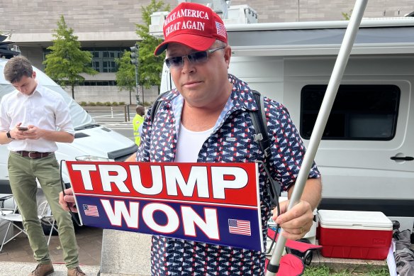 Trump supporter Dion Cini awaits the former president’s arrival at court.