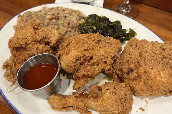 Buttermilk fried chicken with collard greens and Hoppin’ Johns from Poogan’s Porch in Charleston.