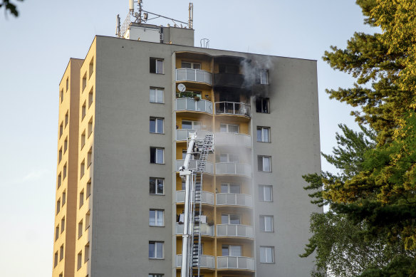 Firefighters battle a fire in an apartment building in Bohumin, north-eastern Czech Republic, in which at least 11 people have been killed.
