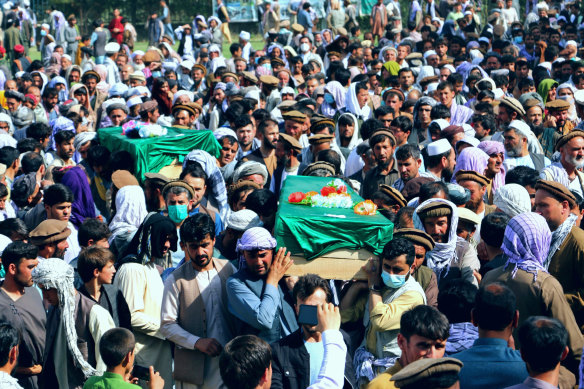 Afghans carry the body of civilians killed during fighting between the Taliban and security forces, during their funeral in Badakhshan province on Sunday.