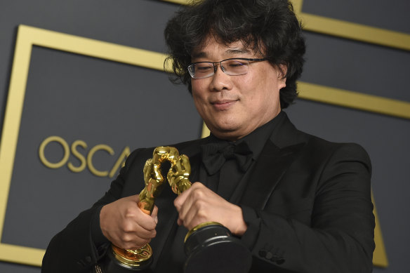 Bong Joon-Ho with the awards for best director and best international feature film for Parasite at the Oscars.