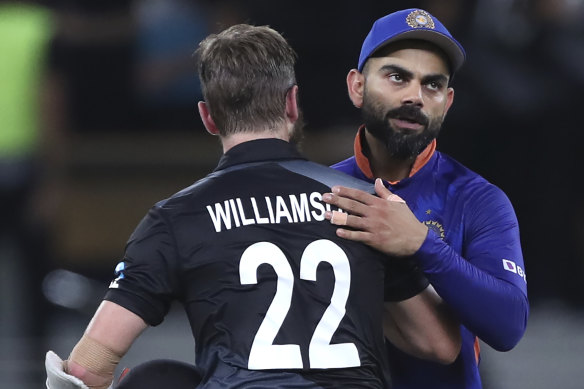 A dejected Virat Kohli with Kane Williamson in 2021.
