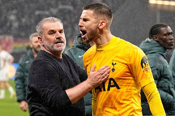 Ange Postecoglou celebrates with Guglielmo Vicario after Tottenham’s win over Eintracht Frankfurt.