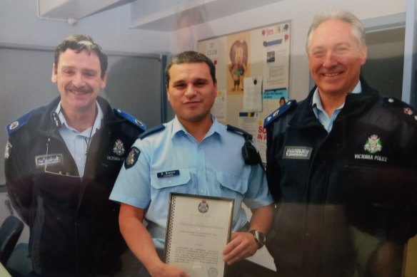 David Branov (centre) receiving a divisional commendation, before everything went bad.