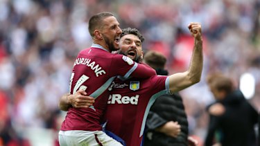 Home calling: Mile Jedinak, celebrating Villa's promotion, could still play in the A-League with Macarthur FC.