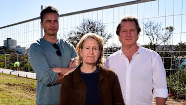Disability advocate Adam Long (left), artist Sally Kiddal (centre) and founding director of Sculpture by the Sea David Handley in front of construction work for the new path at Marks Park in July.