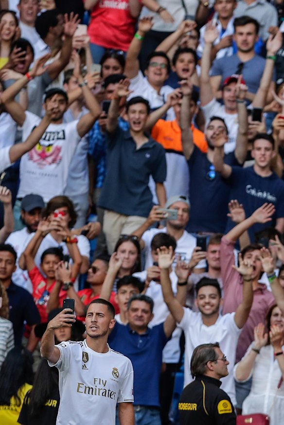 Smile: Eden Hazard is unveiled as a Real Madrid player.